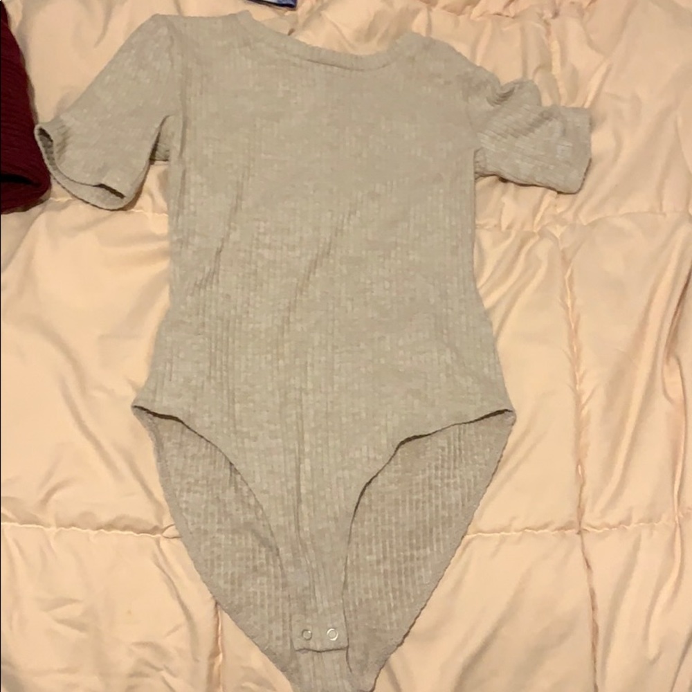 Cream colored body suit